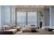 Airy living room featuring modern lighting, comfortable seating, and tall windows at 16459 Hillsborough Blvd, Port Charlotte, FL 33954