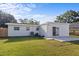 View of the backyard, patio area, and extension of the home at 1740 Lucas Dr, Clearwater, FL 33759