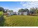 Spacious backyard with a modern shed and fenced perimeter for privacy at 1740 Lucas Dr, Clearwater, FL 33759