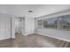 Bedroom with great natural light, multiple closets, and durable wood-look flooring at 1937 N Highland Ave, Clearwater, FL 33755