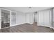 Large bedroom featuring updated flooring, ample closet space, and a ceiling fan at 1937 N Highland Ave, Clearwater, FL 33755