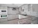 Well-appointed kitchen with white cabinets, stainless steel appliances, and stylish countertops at 1937 N Highland Ave, Clearwater, FL 33755
