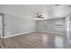 Inviting living room with wood-look tile flooring, natural light, and neutral color palette at 1937 N Highland Ave, Clearwater, FL 33755