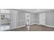 Spacious living room features updated flooring, neutral paint, and abundant natural light at 1937 N Highland Ave, Clearwater, FL 33755