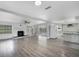 Spacious living area with an open floor plan that connects to the kitchen and adjacent rooms at 1937 N Highland Ave, Clearwater, FL 33755