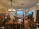 Spacious living and dining area with hardwood floors, comfortable seating, and TV at 2247 Golden Oak Ln, Valrico, FL 33594