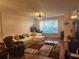 Comfortable living room with a large window, plush seating, and stylish decor at 2247 Golden Oak Ln, Valrico, FL 33594