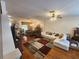 Open-concept living and dining area featuring hardwood floors and abundant natural light at 2247 Golden Oak Ln, Valrico, FL 33594