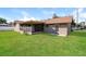 A charming home featuring a lush backyard with a patio and plenty of room to enjoy the outdoors at 3460 Tomahawk Ave, Spring Hill, FL 34606
