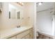 Clean bathroom featuring modern fixtures, neutral vanity, and a walk-in shower with tiled walls and floor at 3460 Tomahawk Ave, Spring Hill, FL 34606