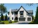 Wonderful two-story home with a brick exterior, gray roof, arched entry, and a two-car garage at 4013 W Inman Ave, Tampa, FL 33609