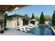 Gorgeous backyard pool with lounge chairs, a spa and a pool house at 4013 W Inman Ave, Tampa, FL 33609