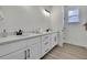 Bathroom with double vanity, modern fixtures, and natural light at 9739 Loretto St, Spring Hill, FL 34608