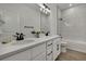 Bathroom showcasing a double vanity, walk-in shower, and modern finishes at 9739 Loretto St, Spring Hill, FL 34608