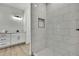 Bathroom featuring stylish vanity, walk-in shower, and modern finishes at 9739 Loretto St, Spring Hill, FL 34608