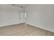 A spacious bedroom featuring a closet, vinyl floors, and neutral paint at 9739 Loretto St, Spring Hill, FL 34608