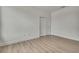 A spacious bedroom featuring a closet, vinyl floors, and neutral paint at 9739 Loretto St, Spring Hill, FL 34608