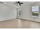 Bright bedroom with natural light, ceiling fan, and neutral paint at 9739 Loretto St, Spring Hill, FL 34608