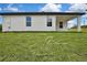 Back side of the house showing two windows and a covered porch at 9739 Loretto St, Spring Hill, FL 34608