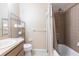 Cozy bathroom featuring a shower-tub combo, vanity with storage, and neutral color scheme at 1049 Presque Isle Dr, Port Charlotte, FL 33952
