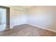 Well-lit bedroom showcasing wood-look tile flooring, and a closet at 1049 Presque Isle Dr, Port Charlotte, FL 33952