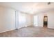 Spacious bedroom with chandelier, wood-look tile flooring, and bright natural light at 1049 Presque Isle Dr, Port Charlotte, FL 33952