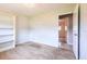 Bedroom featuring tile flooring and view to the bathroom at 1049 Presque Isle Dr, Port Charlotte, FL 33952