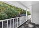 A lovely view from the back porch overlooks green trees and a screened in pool at 4404 Grainary Ave, Tampa, FL 33624