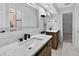 Bathroom featuring double sink vanity with white marble countertop and modern black fixtures at 4404 Grainary Ave, Tampa, FL 33624