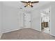 Bright bedroom featuring neutral walls, carpet, and an open doorway to the ensuite bathroom at 4404 Grainary Ave, Tampa, FL 33624