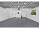 Spacious two-car garage with epoxy floors and ample lighting at 4404 Grainary Ave, Tampa, FL 33624
