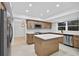 Modern kitchen with stainless steel appliances, white countertops, and wooden cabinetry at 4404 Grainary Ave, Tampa, FL 33624