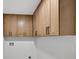 Bright laundry room with modern cabinets providing ample storage space at 4404 Grainary Ave, Tampa, FL 33624