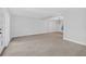 Open living room with neutral paint, tile floors, a modern chandelier and views to other rooms at 4404 Grainary Ave, Tampa, FL 33624
