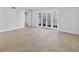 Open living room with neutral paint, tile floors and views to the outdoor patio at 4404 Grainary Ave, Tampa, FL 33624