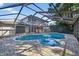 Sparkling private pool enclosed in a screened-in lanai and a brick-paved deck at 4404 Grainary Ave, Tampa, FL 33624