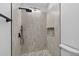 This is a modern tiled walk-in shower with rainfall shower head and built-in niche at 4404 Grainary Ave, Tampa, FL 33624