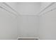 A simple walk-in closet provides storage space with basic wire shelving at 4404 Grainary Ave, Tampa, FL 33624