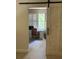 View of the den with barn door and plantation shutters at 4926 Anniston Cir, Tampa, FL 33647