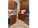 Spacious kitchen featuring wood cabinets, tile flooring, and stainless-steel appliances at 4926 Anniston Cir, Tampa, FL 33647