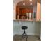 Charming kitchen featuring stainless steel appliances, wood cabinets, and tile flooring at 4926 Anniston Cir, Tampa, FL 33647