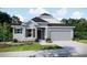 Charming single-story home with a two-car garage, neat landscaping, and a welcoming entrance at 12515 Shafton Rd, Spring Hill, FL 34609