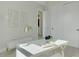 Bright office space features a modern desk, shelving, and a contemporary design aesthetic at 3323 Elkcam Blvd, Port Charlotte, FL 33952