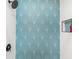 Modern shower adorned with stylish blue and white patterned tile and black hardware at 4311 123Rd W St, Cortez, FL 34215
