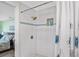 Modern bathroom featuring a tiled shower, niche, and bronze shower head at 4311 123Rd W St, Cortez, FL 34215