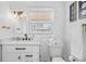 Clean, modern bathroom with white vanity, black hardware, and good natural light at 4311 123Rd W St, Cortez, FL 34215