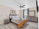Cozy bedroom with stylish bed, contemporary furnishings, and decorative elements at 4311 123Rd W St, Cortez, FL 34215