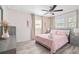 Bright bedroom featuring a comfortable bed, stylish furnishings, and soothing color palette at 4311 123Rd W St, Cortez, FL 34215