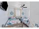 Charming nautical-themed bedroom featuring two twin beds and beach-inspired decor at 4311 123Rd W St, Cortez, FL 34215