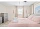 Bright bedroom featuring a comfortable bed, stylish furnishings, and soothing color palette at 4311 123Rd W St, Cortez, FL 34215